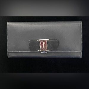 Authentic Salvatore Ferragamo, black long wallet with silver hardware, g…